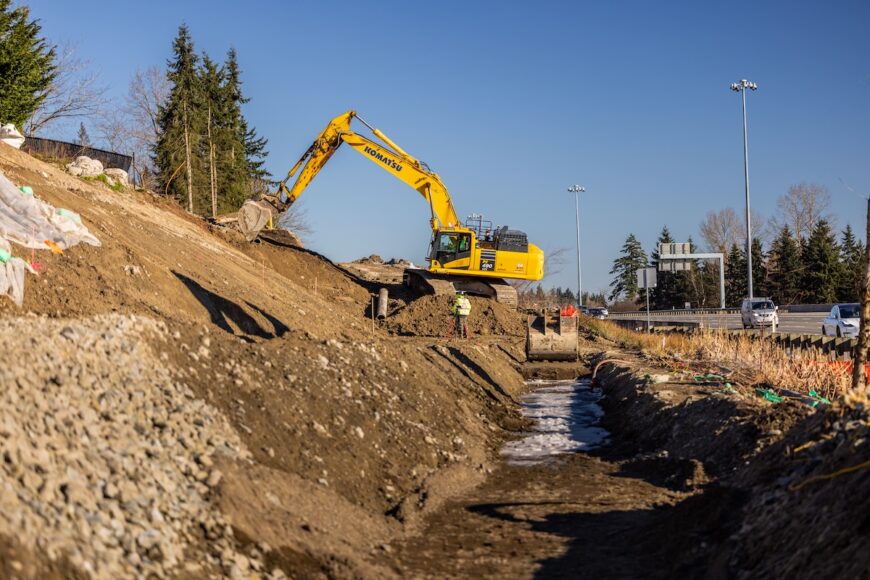 F200 excavator excavating hillside