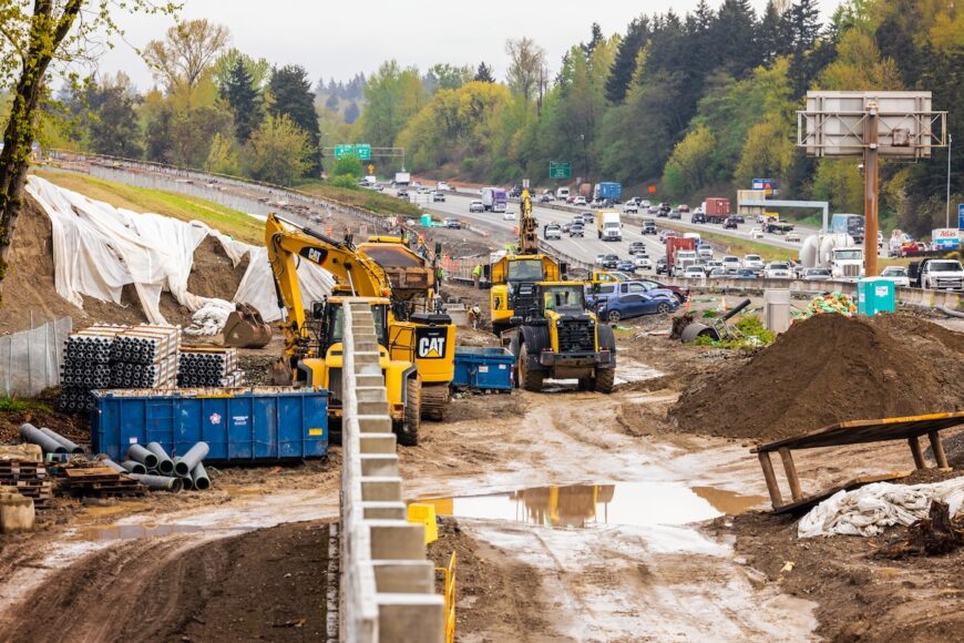 F200 multiple pieces of construction equipment working together along I5