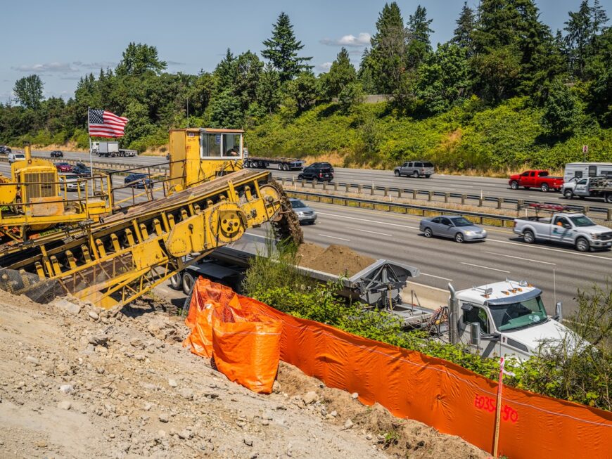 F200 belt loader loading trucks alongside I5