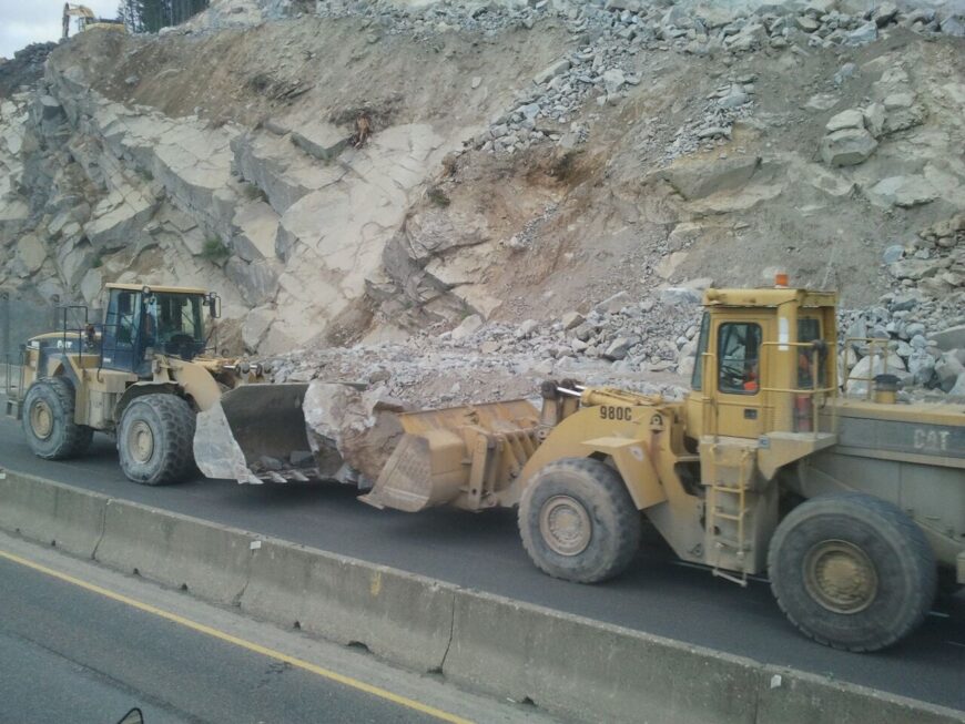 The Hyaks Two loaders moving large boulder after a rock blast