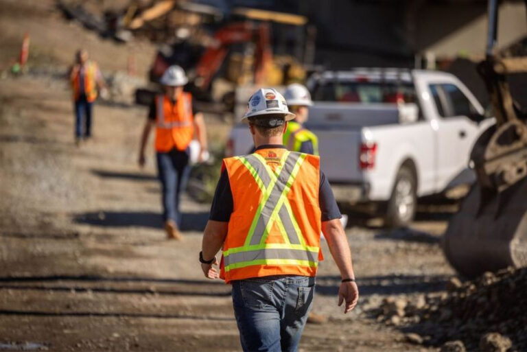 Worker wearing construction vest on site