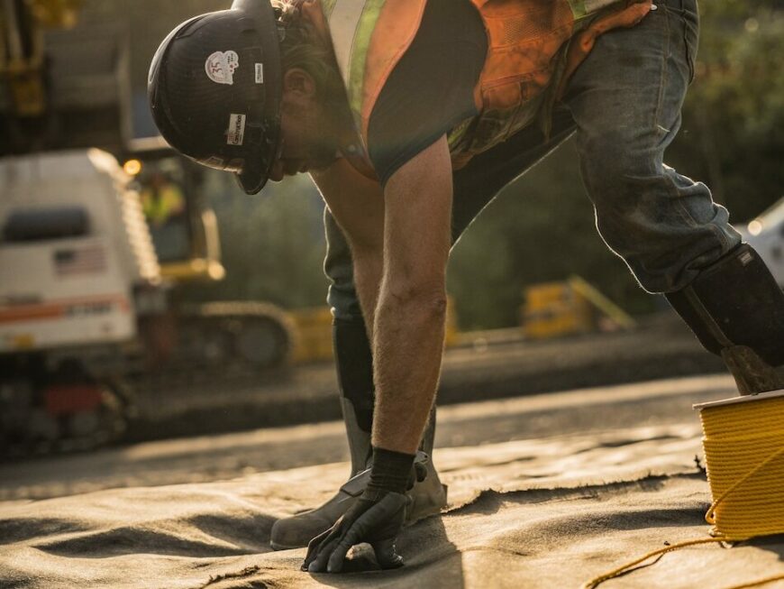 Worker installing material